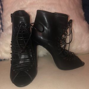 Tall black leather tie up peep toe heels